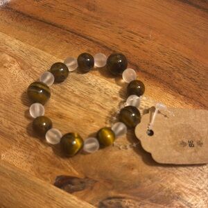 Elegant Brown and White Bracelet with Intricate Design